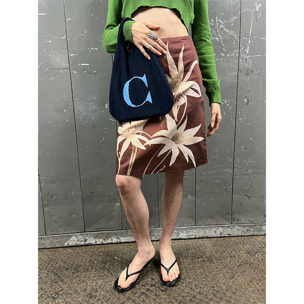 Model wearing HADES letter C bag