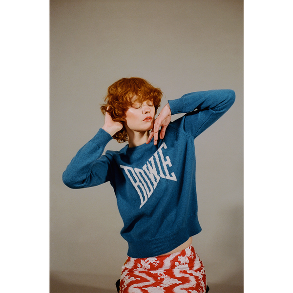 Model shot of the teal blue and ecru David Bowie 'Let's Dance' jumper styled with the 'So this is hell' skirt 