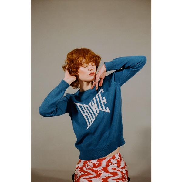 Model shot of the teal blue and ecru David Bowie 'Let's Dance' jumper styled with the 'So this is hell' skirt