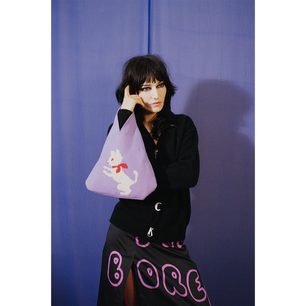 Model holding HADES Kitten Bag