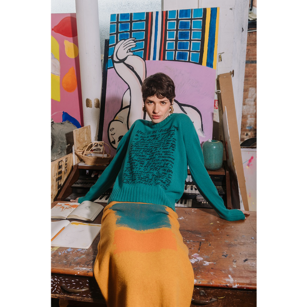 Model wearing HADES jade Manifesto Jumper