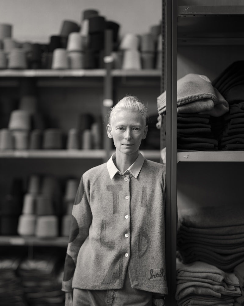 A black and white image of Tilda Swinton at the factory in Hawick.