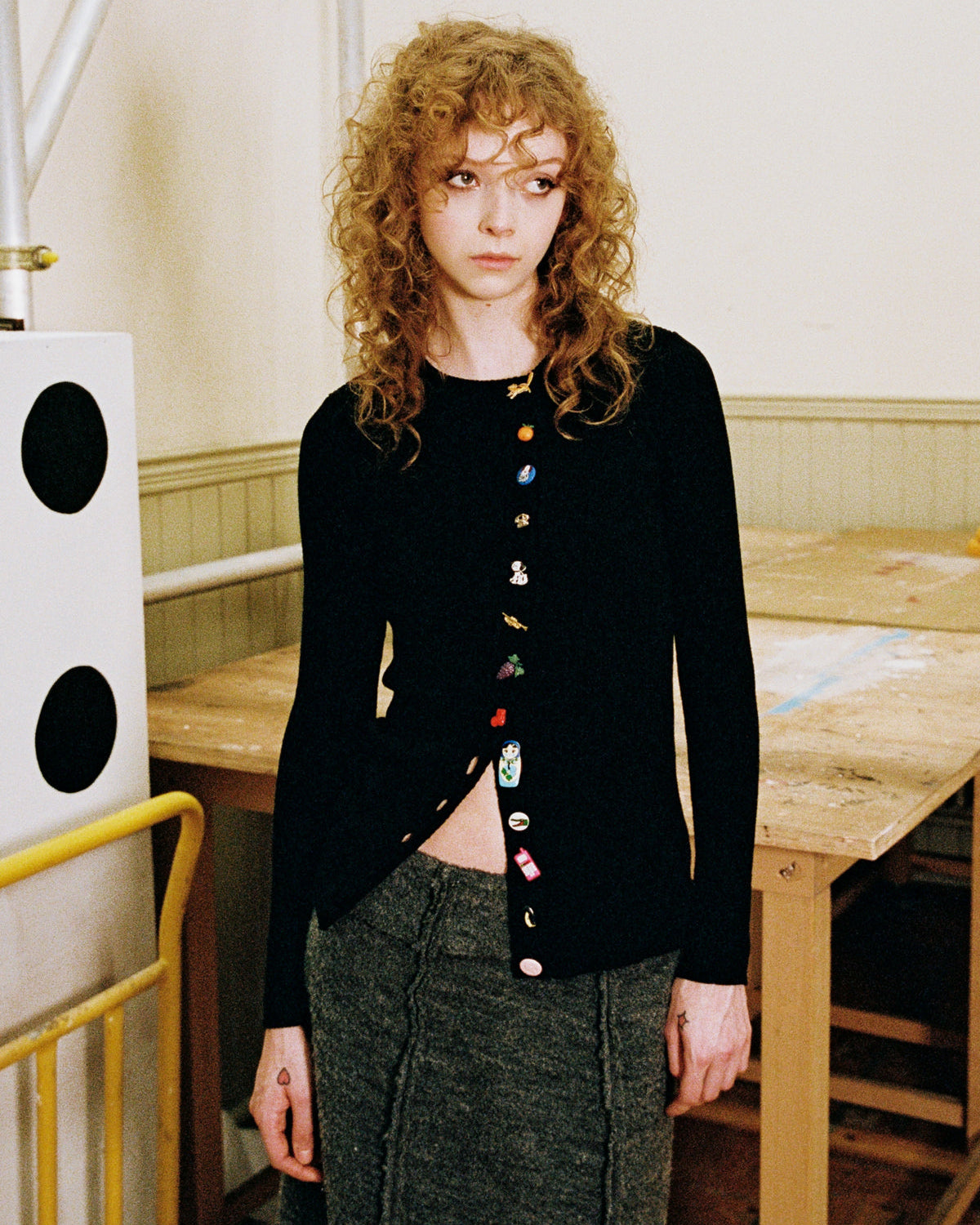 An image of a model wearing the Asymmetrical Cardigan from the Nothing You Can See Collection
