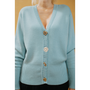 HAES 138 cardigan worn by model. Light blue cardigan with decorative buttons.
