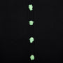 Close-up of a black ribbed knit cardigan featuring four mint green Greek Mythology buttons down the front.