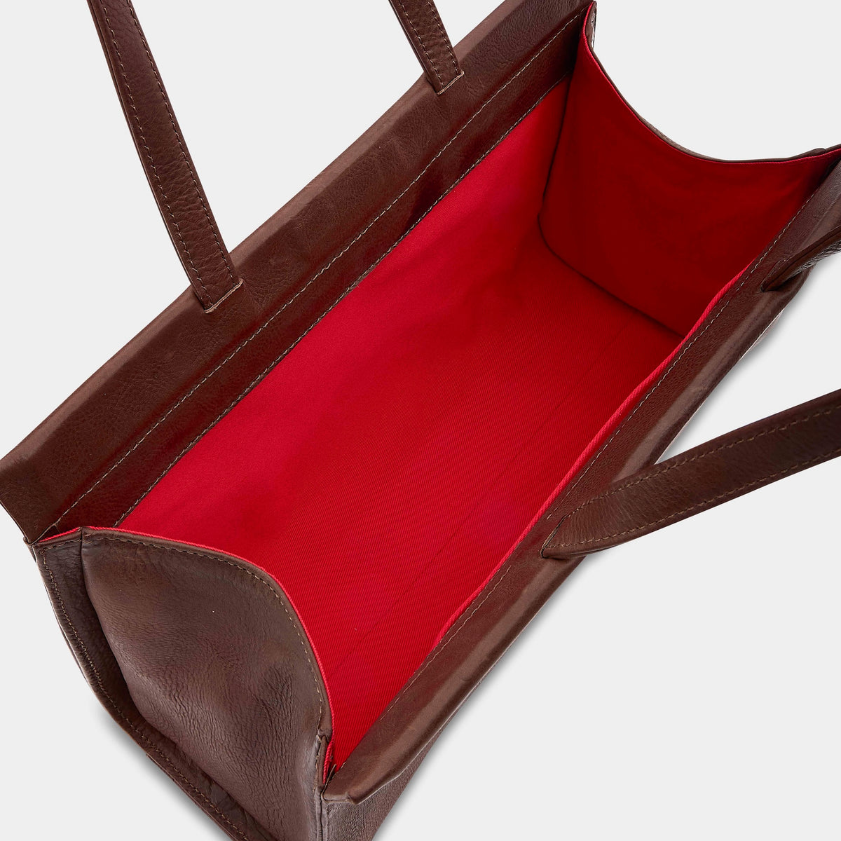 An image showing the inside of the HADES Despair Bag with red lining. 