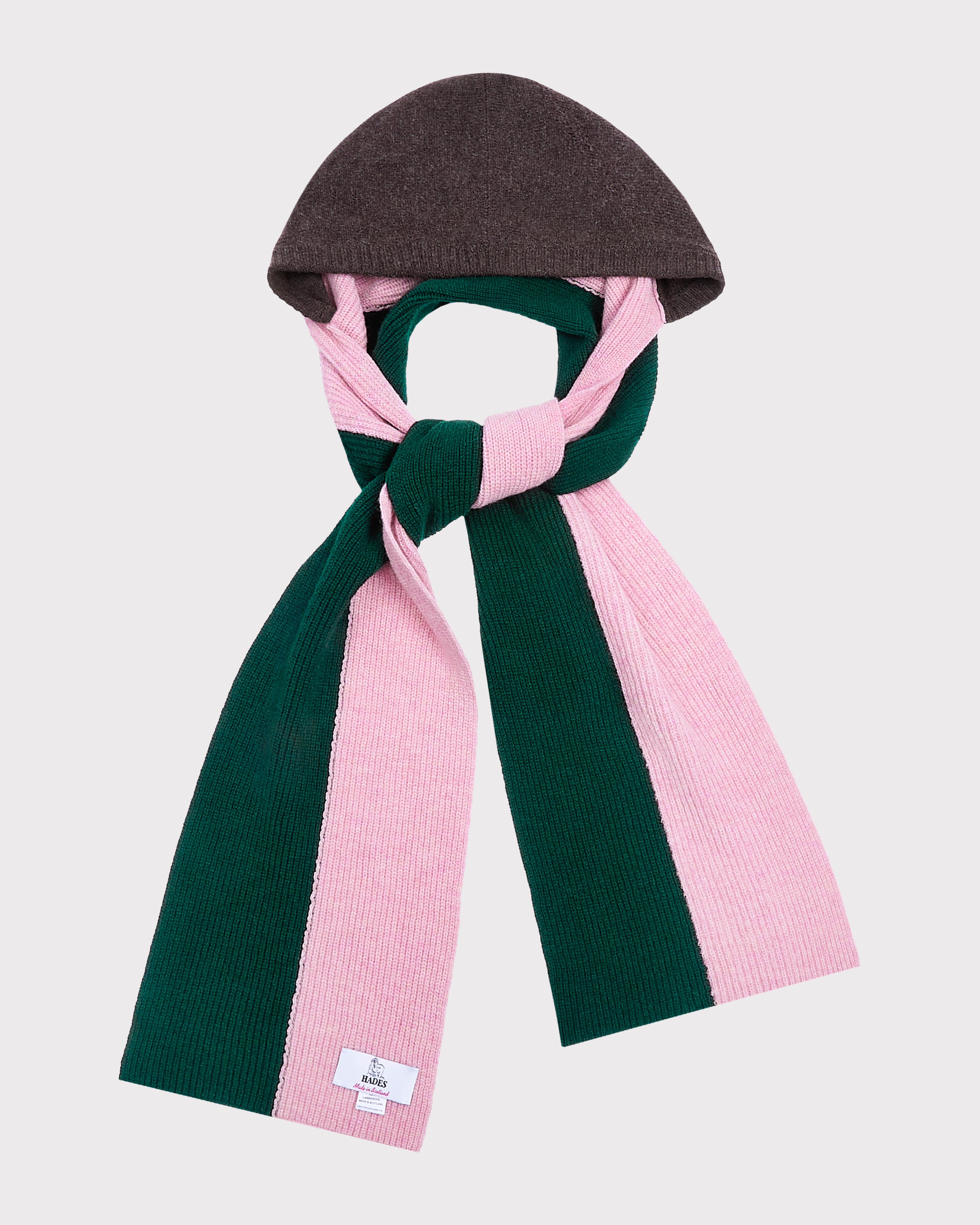 An image of The Forest Green and Pink hooded scarf tied in a knot on a light grey background. 
