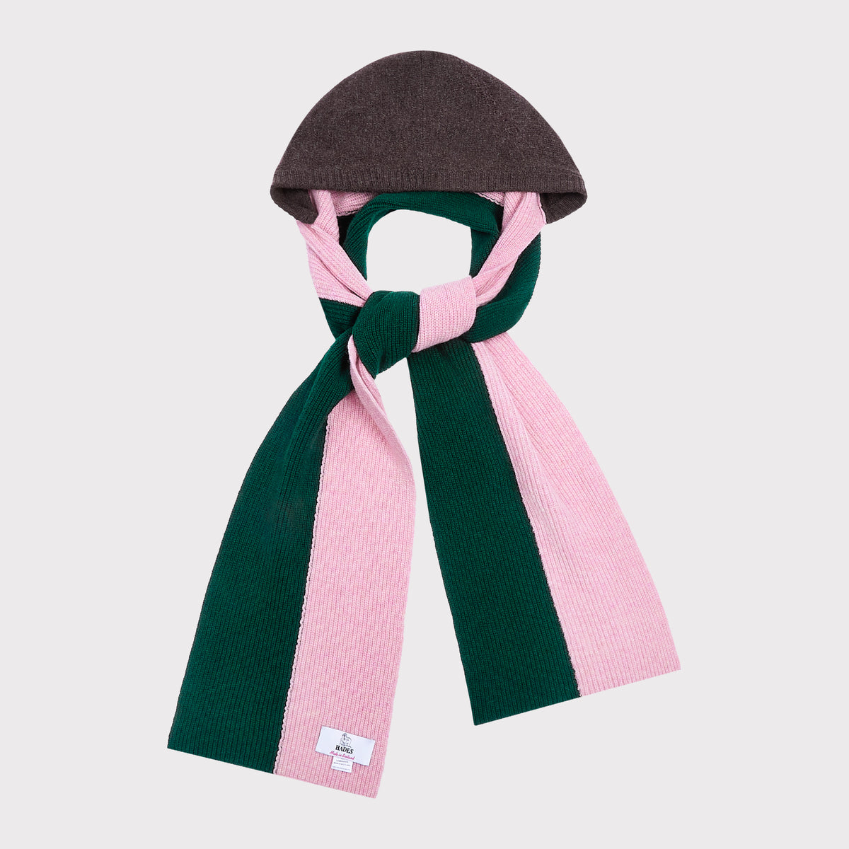 An image of The Forest Green and Pink hooded scarf tied in a knot on a light grey background. 