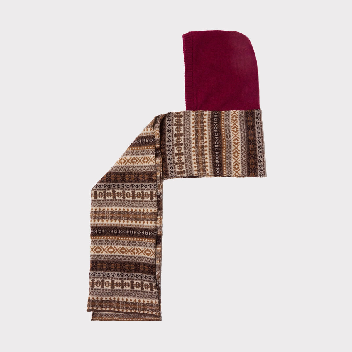 An image of The Berry & Brown Fair Isle hooded scarf laid flat on a light grey background. 