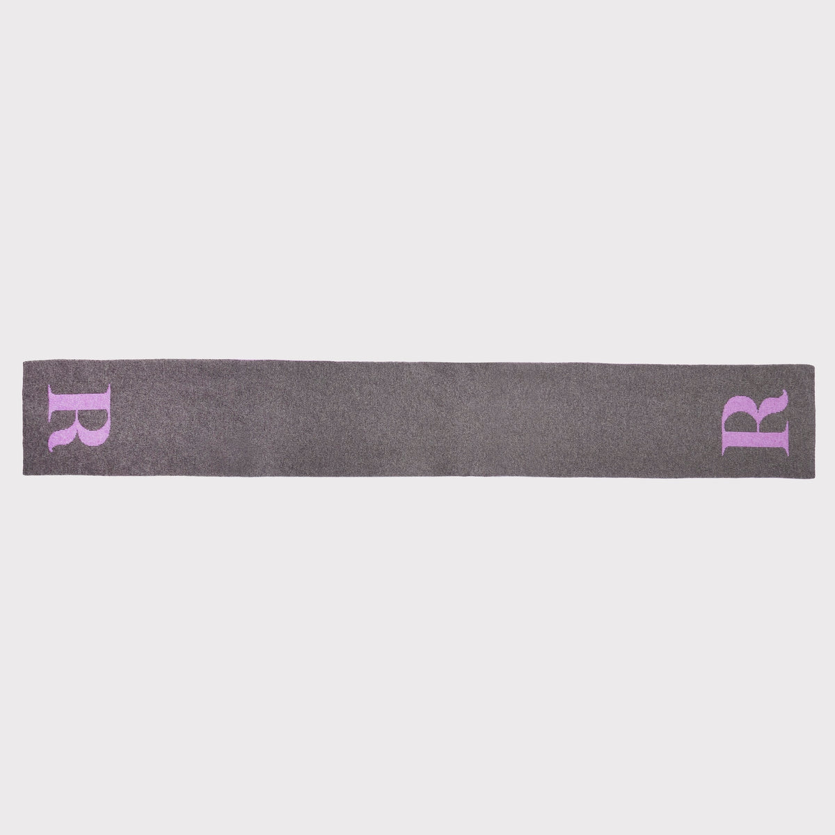 A dark grey knitted scarf featuring a light purple embroidered letter 'R' on each end, displayed against a solid light grey background.