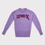A purple knit with 'FLEETWOOD MAC' arched in dark red  lettering across the chest, displayed on a light grey background.