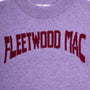 Close-up of the purple Albatross knit sweater with 'FLEETWOOD MAC' knitted in dark red across the chest.