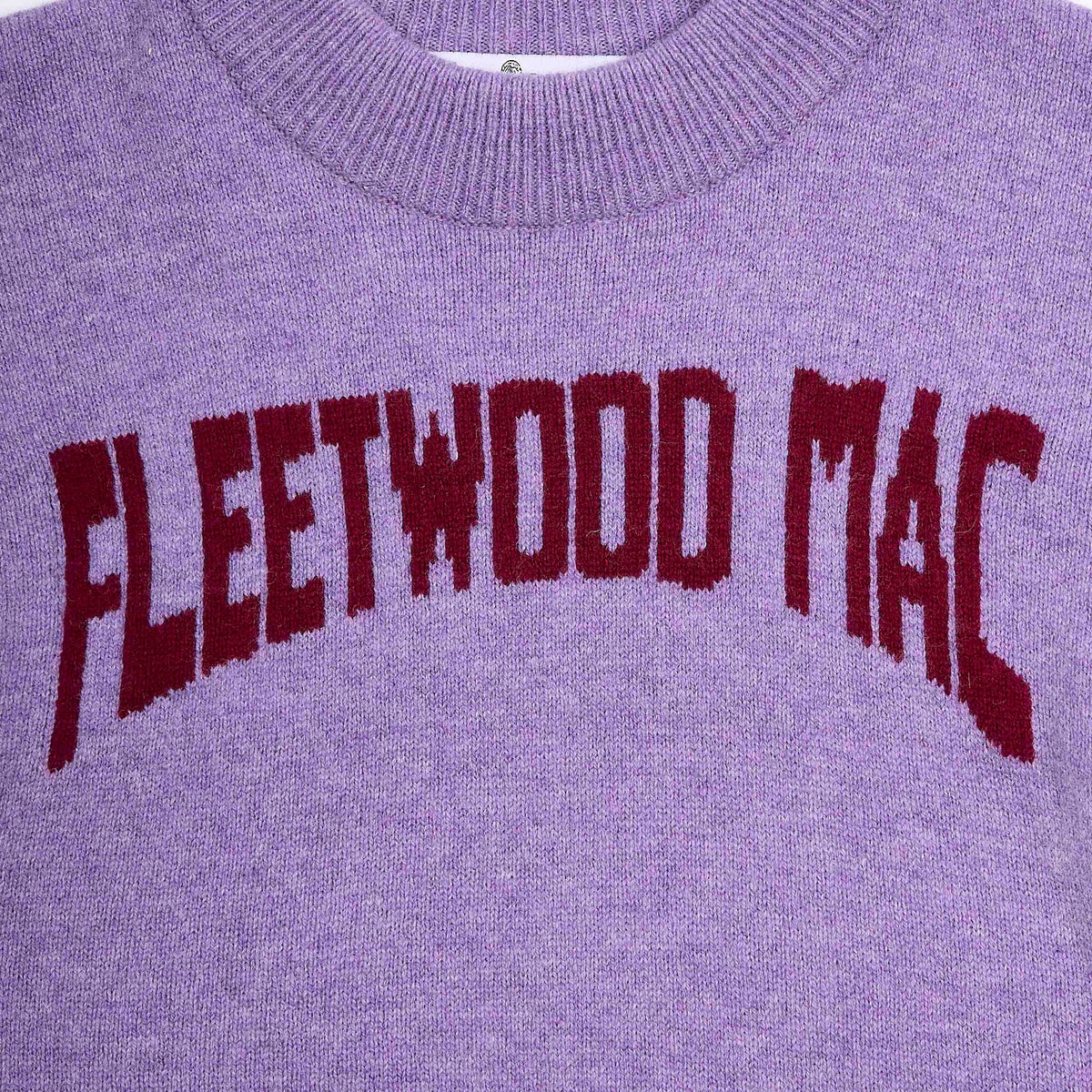 Close-up of the purple Albatross knit sweater with 'FLEETWOOD MAC' knitted in dark red across the chest.