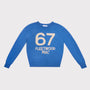 A blue crewneck knit sweater with '67 FLEETWOOD MAC' printed in cream on the front, displayed flat against a light grey background.