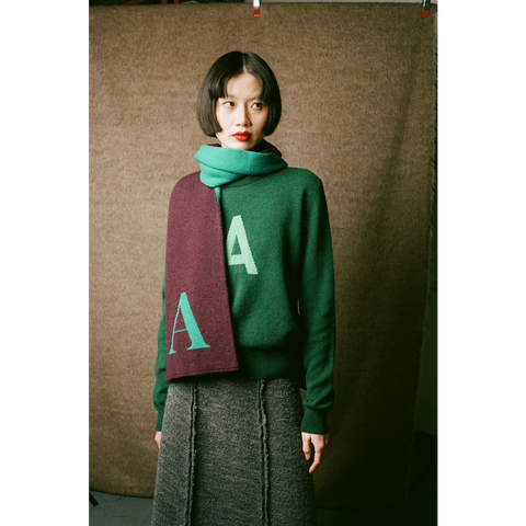 Model wearing HADES Alphabet letter A scarf and A jumper