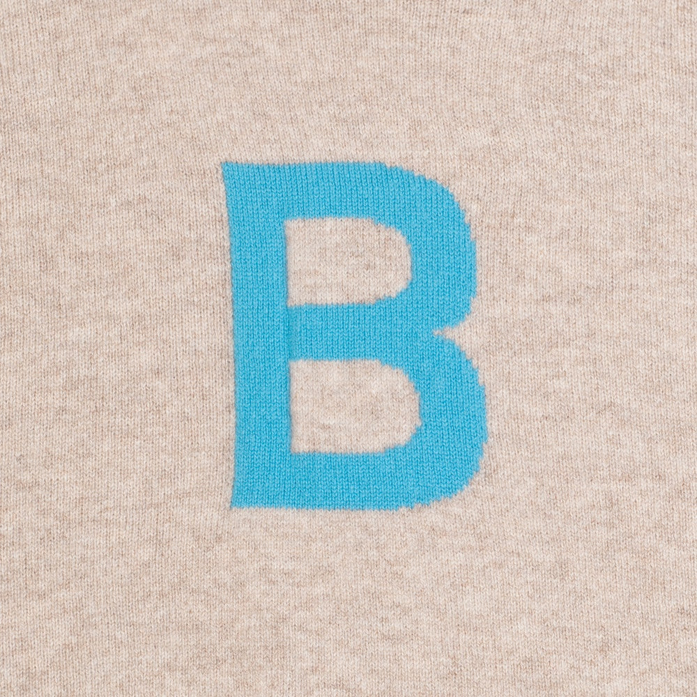 HADES grey knit with a blue letter 'B' detail