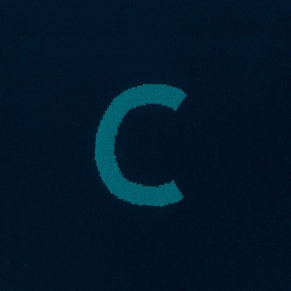 HADES Navy blue knit  with a turquoise letter 'C' detail