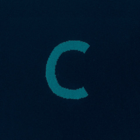 HADES Navy blue knit  with a turquoise letter 'C' detail