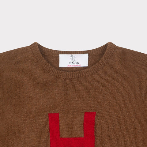 HADES brown jumper with a red letter 'H' necklabel