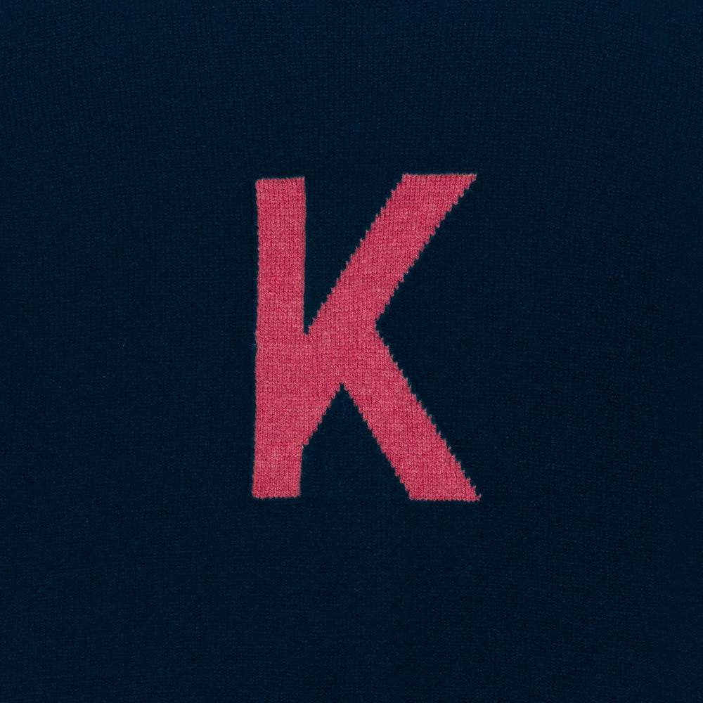 HADES navy sweater with a red letter 'K' detail