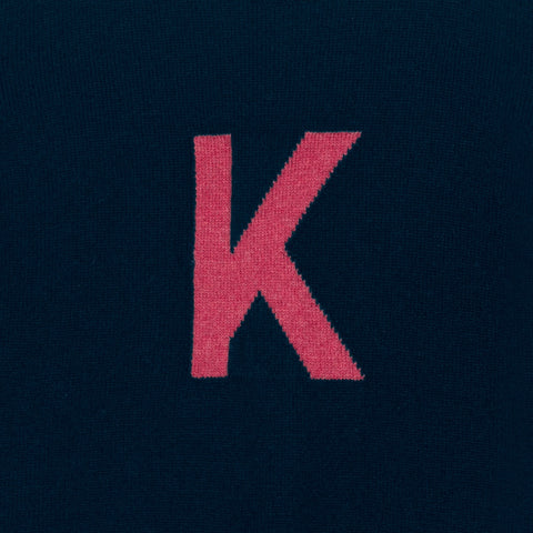 HADES navy sweater with a red letter 'K' detail