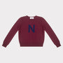HADES burgundy jumper with a blue 'N' 