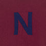 HADES burgundy jumper with a blue letter 'N' detail