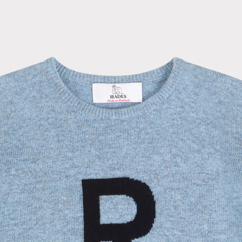 HADES light blue jumper with a navy letter 'R' detail