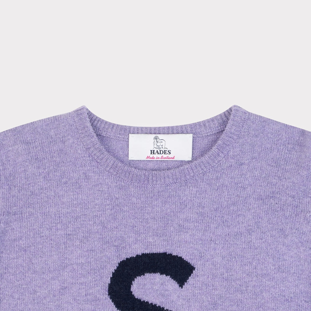 HADES purple jumper with a black 'S' necklabel