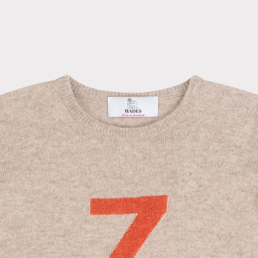 HADES beige sweater with a red letter 'Z' necklabel