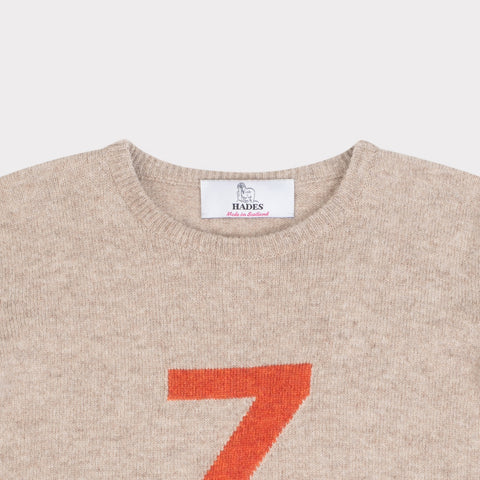 HADES beige sweater with a red letter 'Z' necklabel