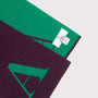 Flat image of the detail and label of the 'A' scarf