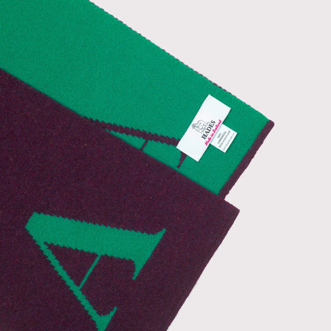 Flat image of the detail and label of the 'A' scarf