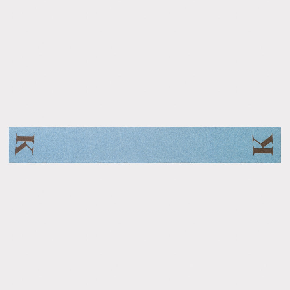 HADES Alphabet letter K scarf in blue and brown flatlay