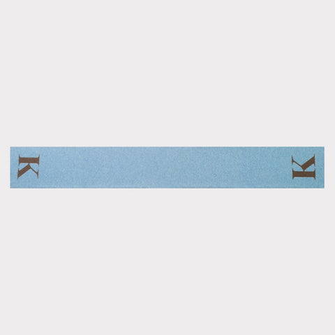 HADES Alphabet letter K scarf in blue and brown flatlay