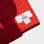Detail image of the 'H' scarf and label from the Alphabet Collection.