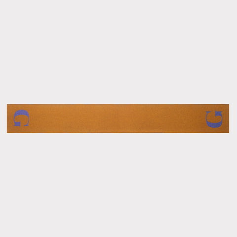 The HADES G letter scarf in bronze and plum laid flat, front view