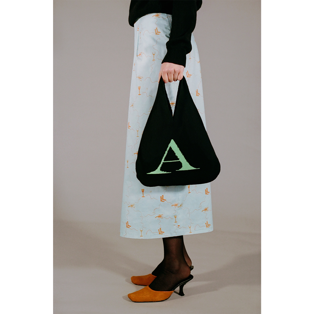 Model holding the HADES wool Letter A bag 