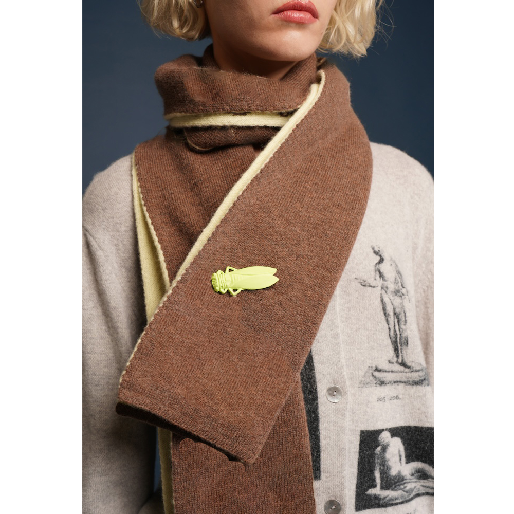HADES brown scarf with a decorative button worn by a model