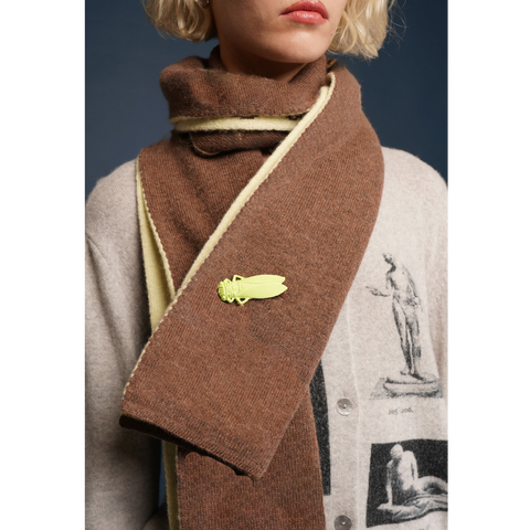 HADES brown scarf with a decorative button worn by a model