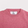 Close up of the neckline on the pink and green Blondie vest