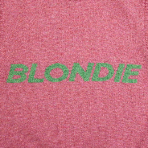 Close up of the slogan from the pink and green Blondie vest