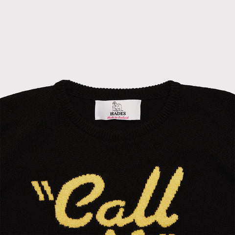 Close up of the black and yellow 'Call Me' Blondie jumper