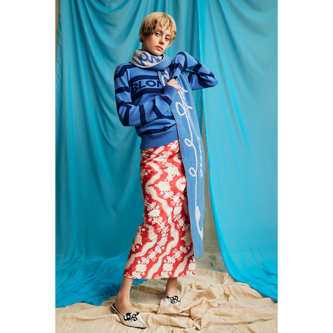 Model wearing HADES Blondie striped jumper in blue