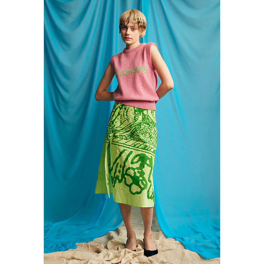 Model wearing HADES Blondie vest styled with HADES skirt
