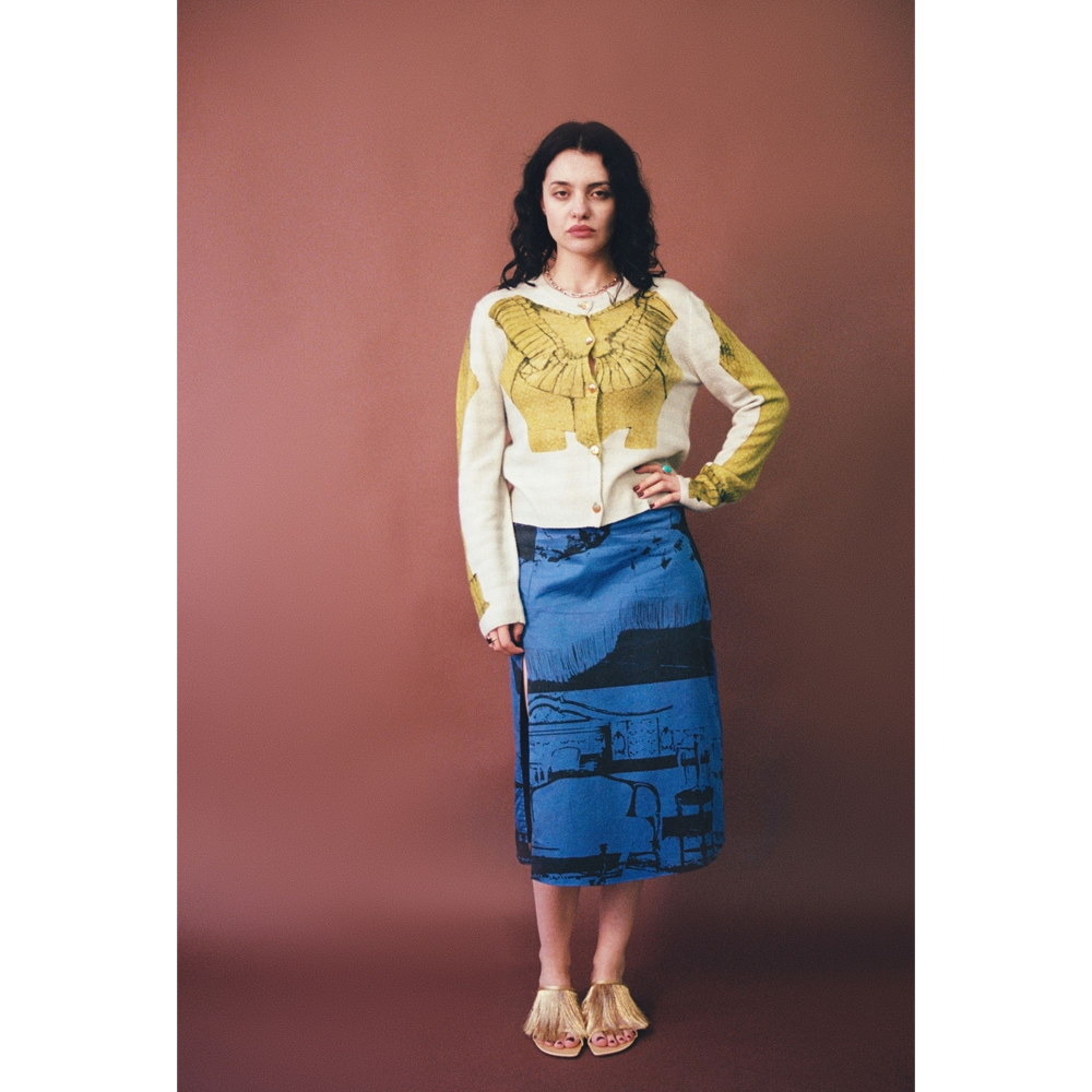 Model wearing HADES Wool Bodice Cardigan on brown backdrop
