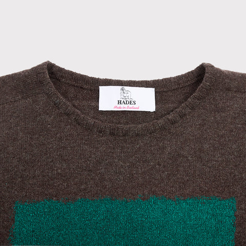 Detail flatshot of neckline and label on Gesture knit.