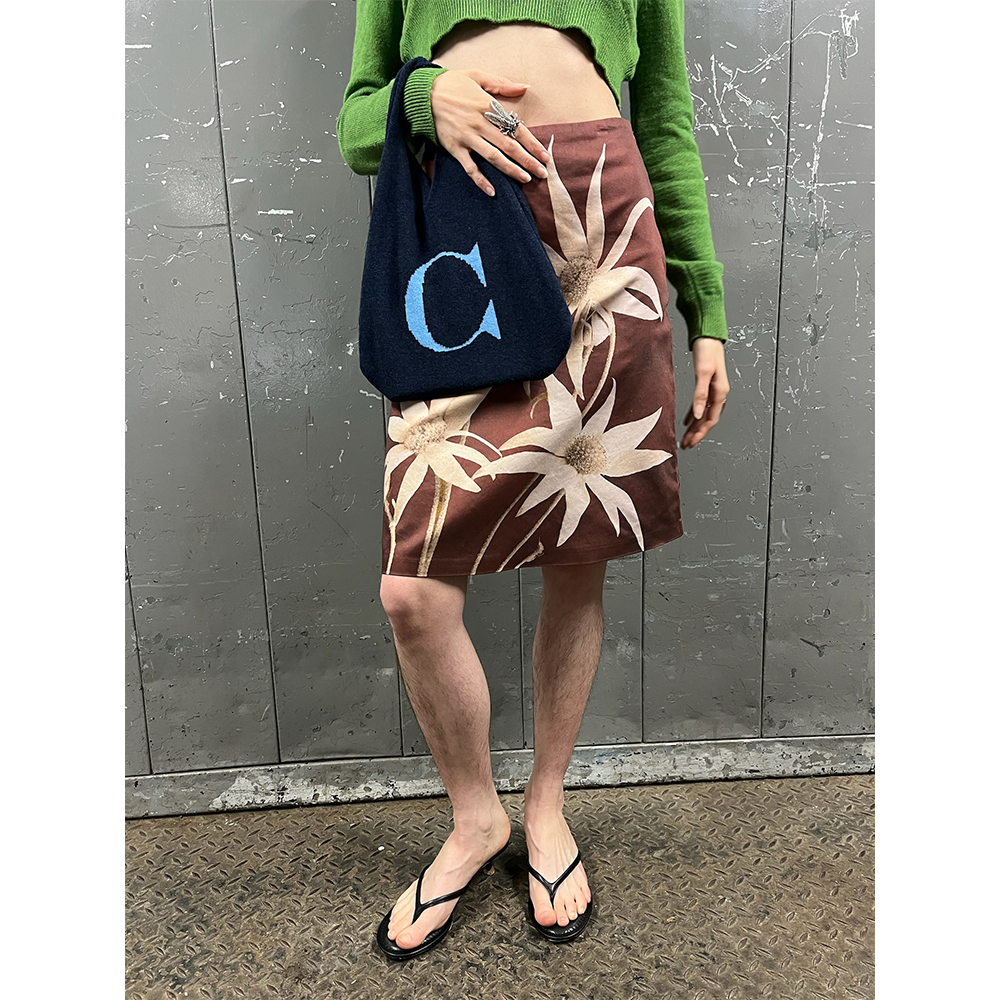 Model wearing HADES letter C bag