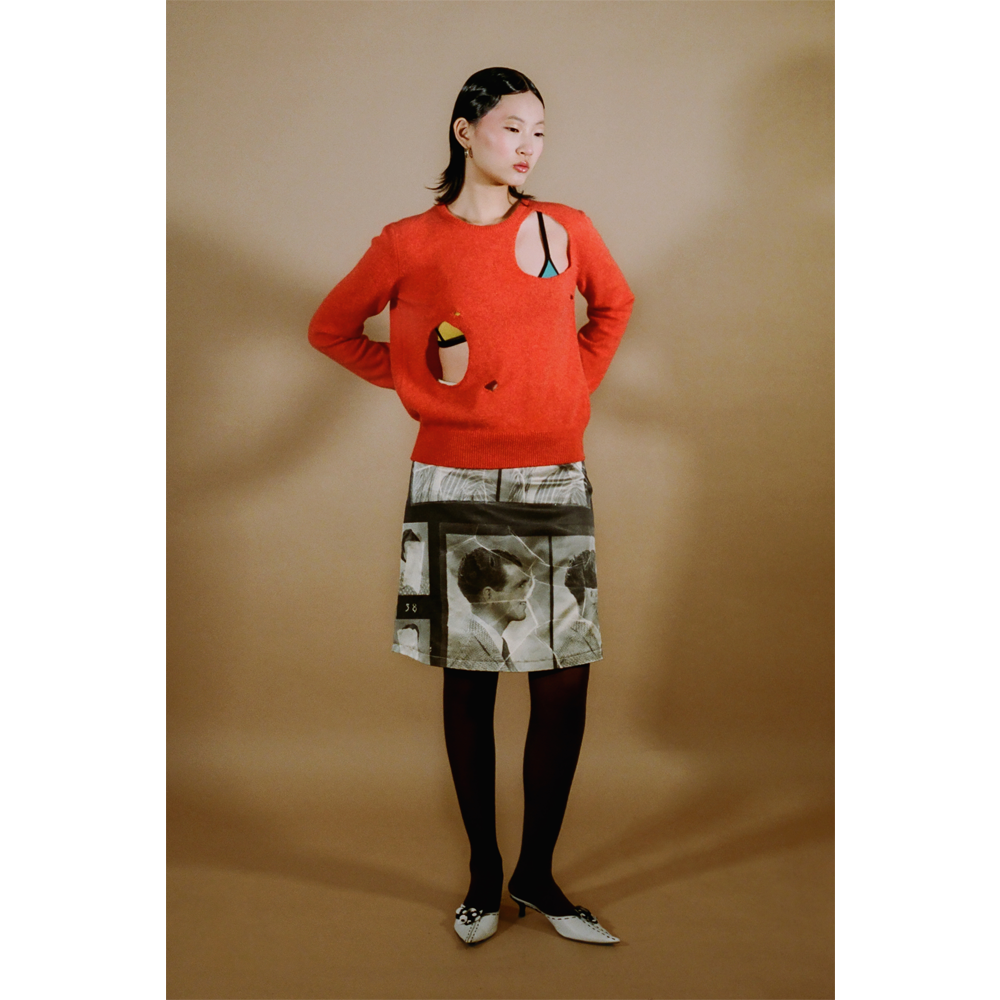 Model shot of the orange Selavy jumper from the DADA Collection