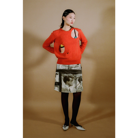 Model shot of the orange Selavy jumper from the DADA Collection